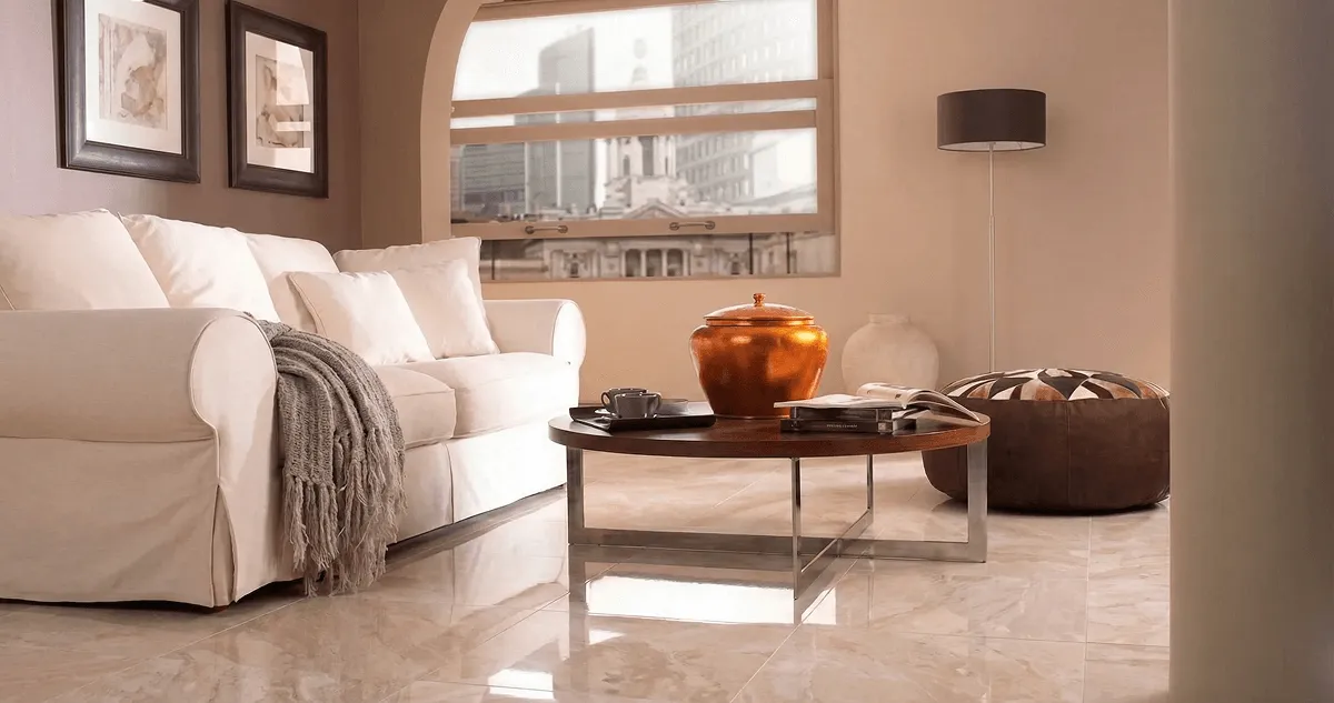 Modern living room with professionally installed marble flooring, a beige sofa, coffee table in Detroit, MI