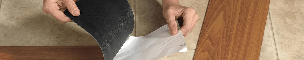 A professional installing vinyl flooring in Detroit, MI